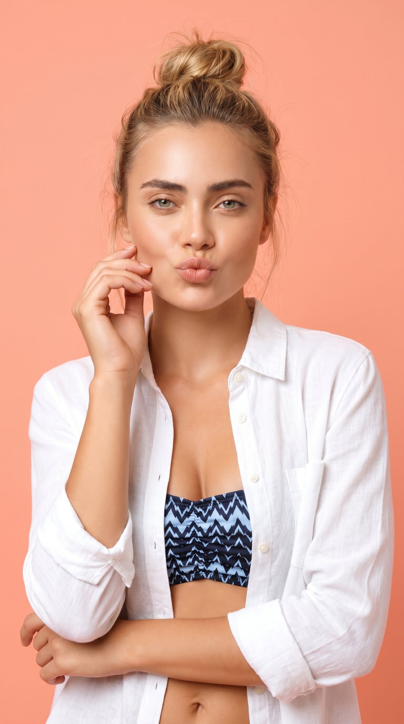 Woman wearing a bikini set with zig zag pattern on a white background.