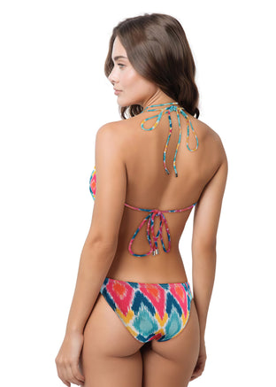 Woman wearing a colorful bikini set on a white background
