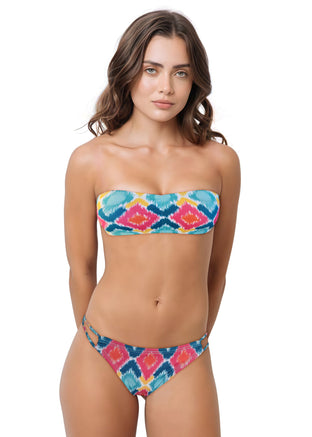 Woman wearing a colorful bikini set on a white background