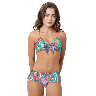Woman wearing a colorful bikini set on a white background