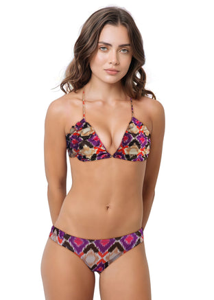 Woman wearing a colorful bikini set on a white background