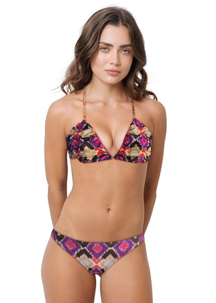 Woman wearing a colorful bikini set on a white background