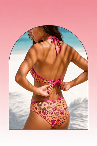 Woman wearing a floral bikini set on a white background