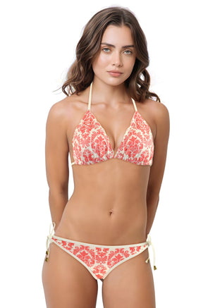 Woman wearing a black patterned bikini on a white background