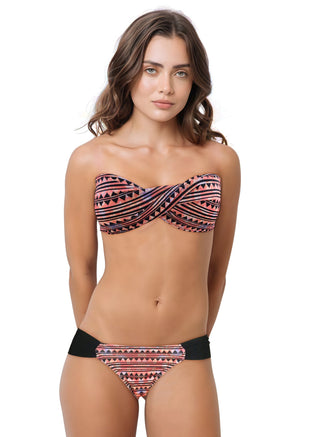 Woman wearing a patterned bikini set on a white background