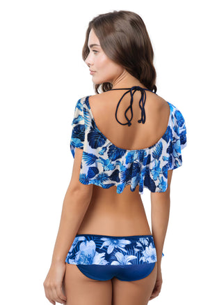 Woman wearing a blue floral two-piece swimsuit on a white background