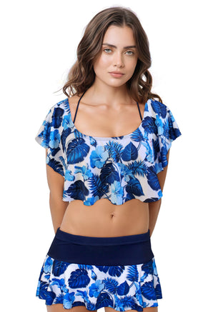 Woman wearing a blue floral two-piece swimsuit on a white background