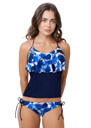 Woman wearing a blue floral bikini on a white background