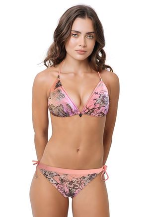 Woman wearing a patterned bikini on a white background