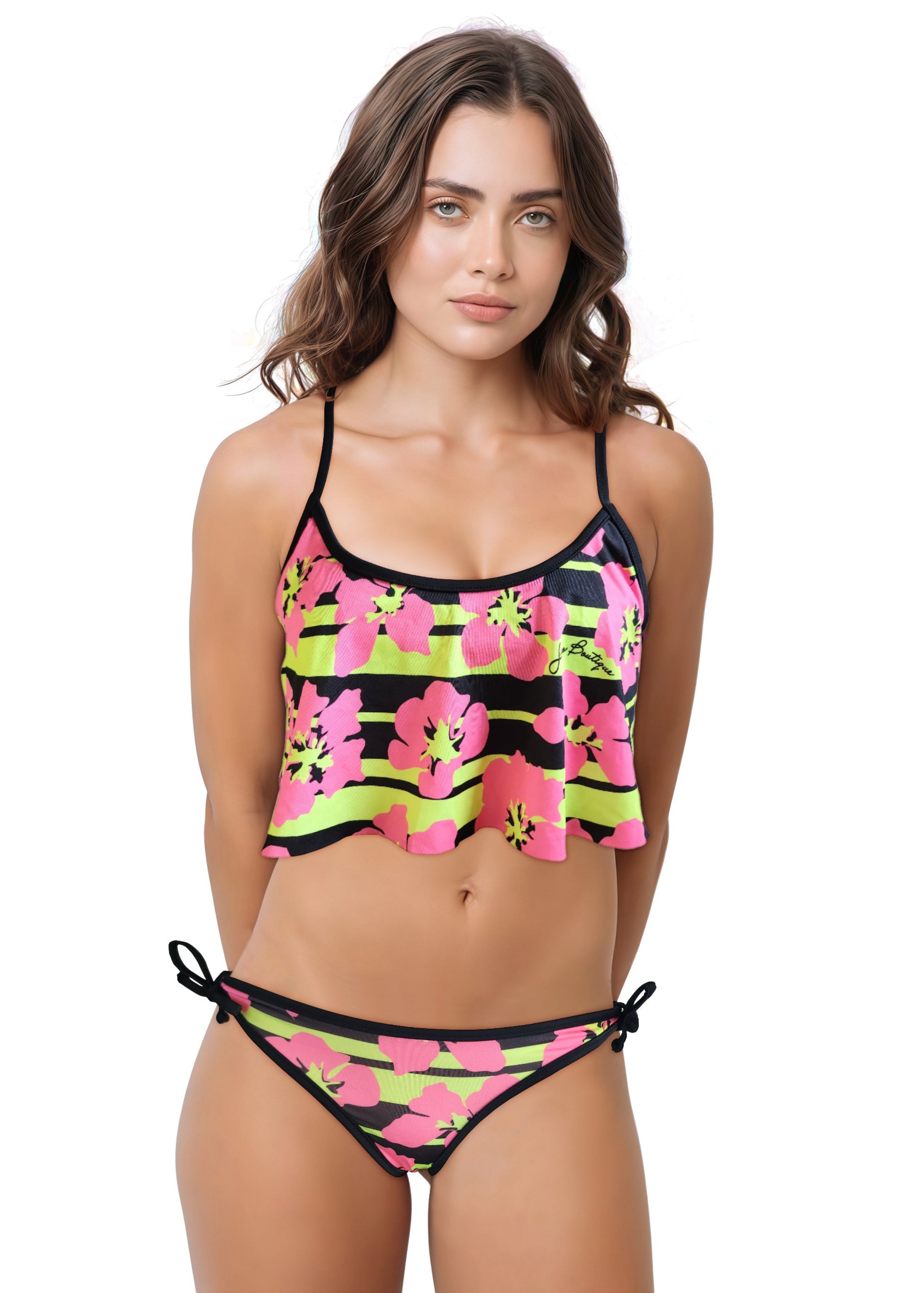 Woman wearing a colorful bikini with pink flowers and black stripes on a white background
