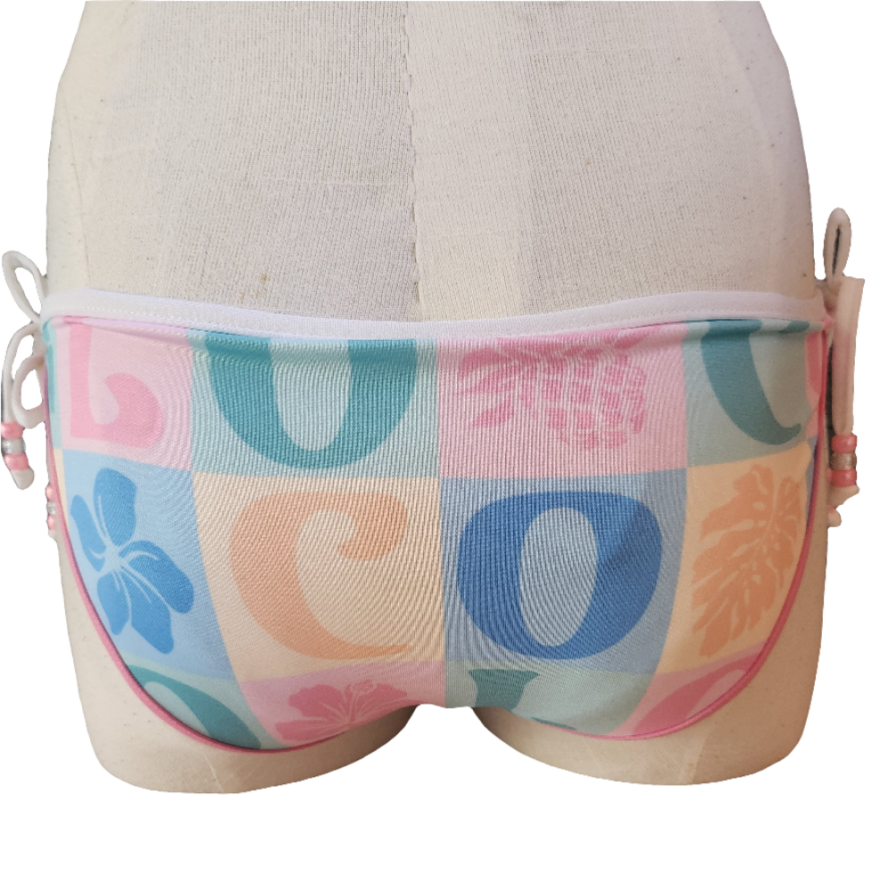 Brown and white floral-patterned underwear on a mannequin with a white background