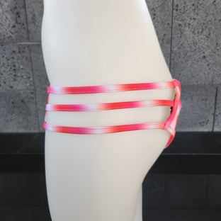 Purple Tie-dye bikini bottom on a mannequin against a gray background