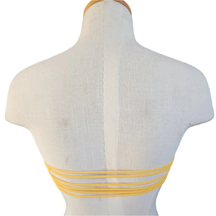 Colorful bandeau top on a mannequin against a white background.