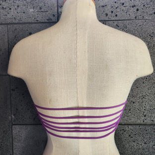 Colorful bandeau top on a mannequin against a white background.