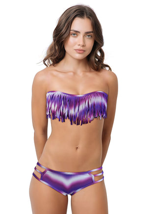 Woman wearing a purple fringe bikini set on a white background