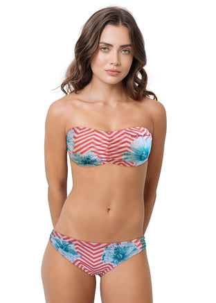 Woman wearing a floral two-piece swimsuit on a white background