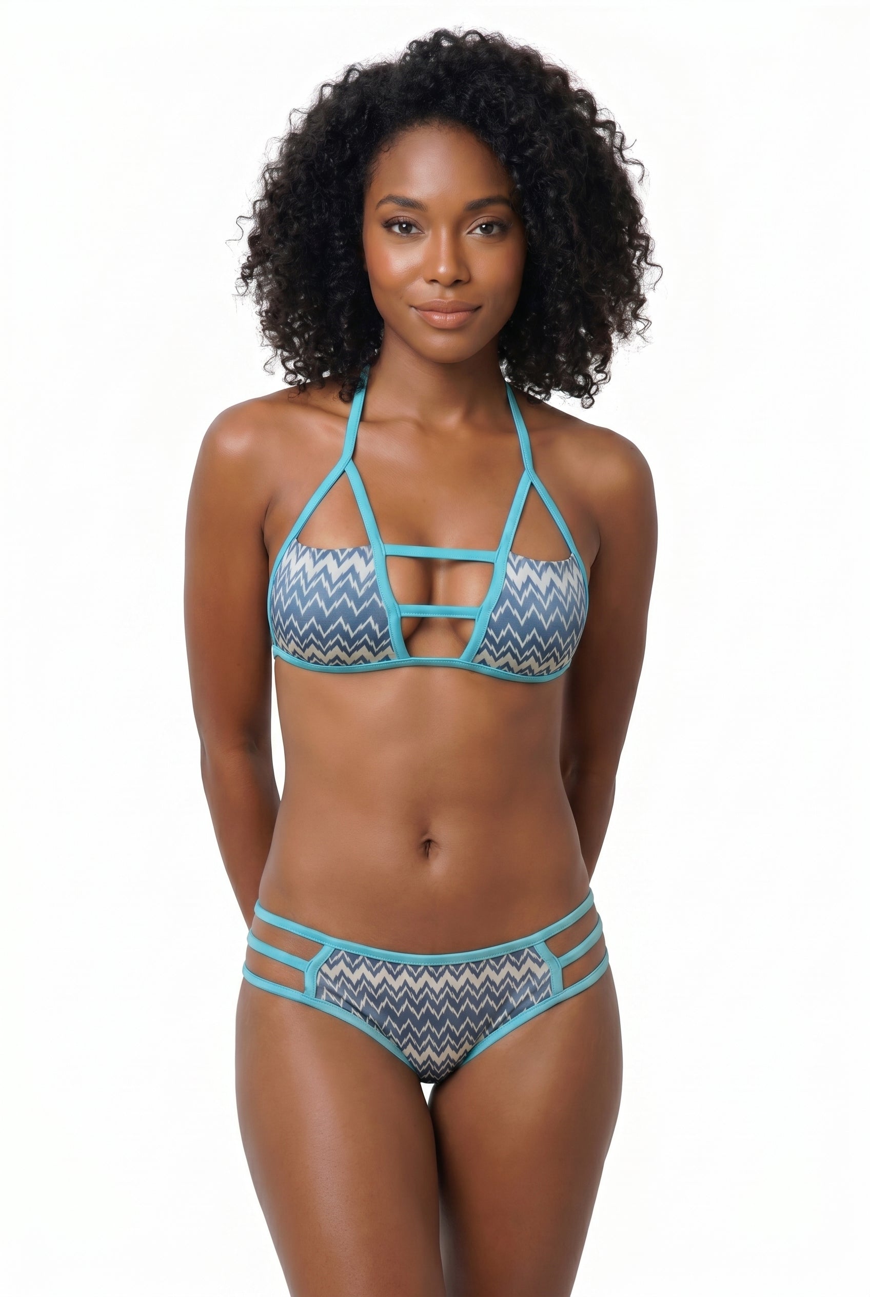Woman wearing a bikini set with zig zag pattern on a white background.