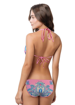 Woman wearing a pink and blue patterned bikini on a white background