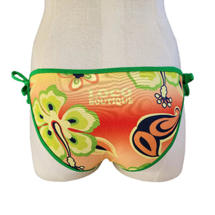 Colorful bikini bottom with green straps on a mannequin against a white background