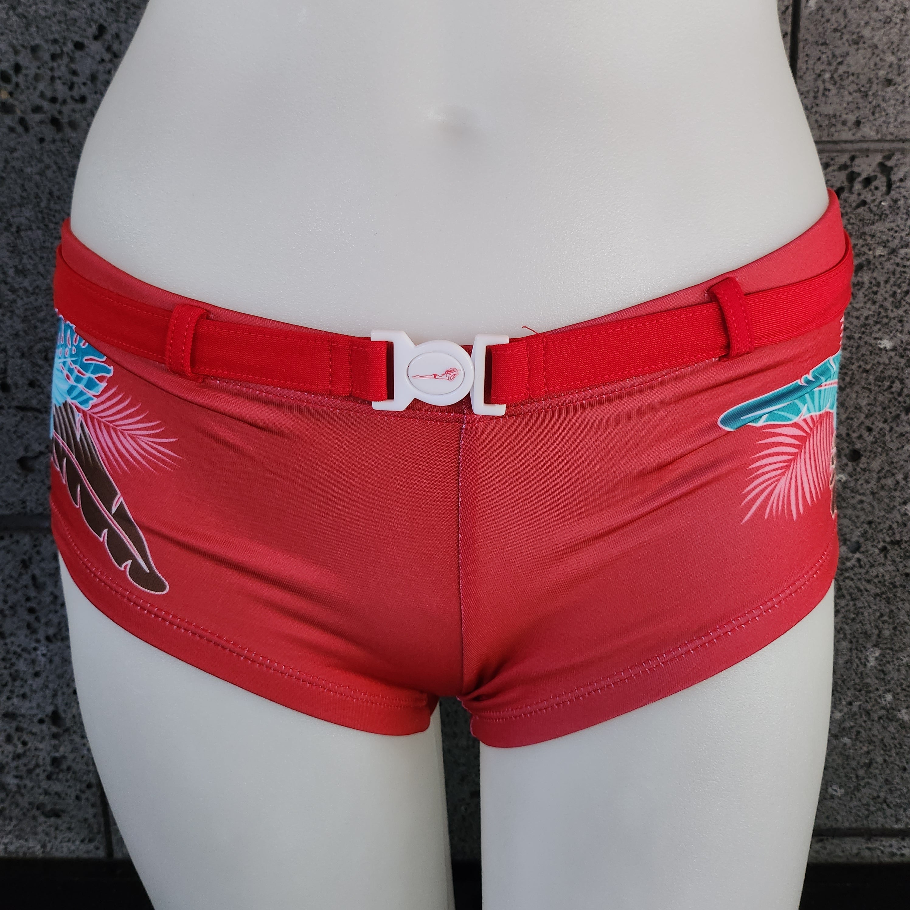 Red swimsuit with floral patterns on a white mannequin