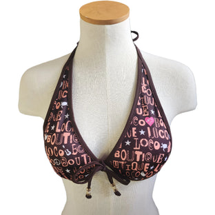 Bikini top with 'Loco Boutique' print on a mannequin