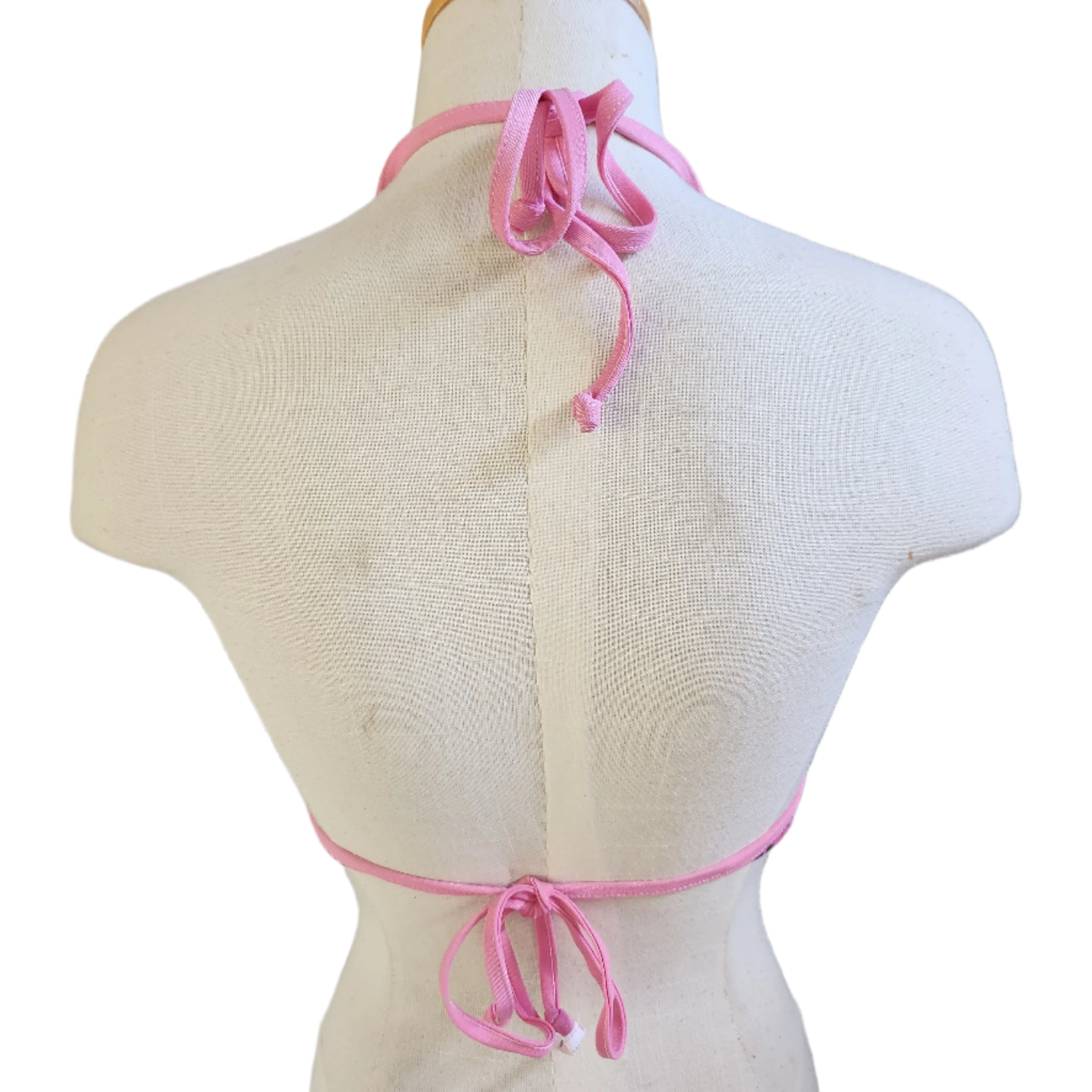 Bikini top with 'Loco Boutique' print on a mannequin