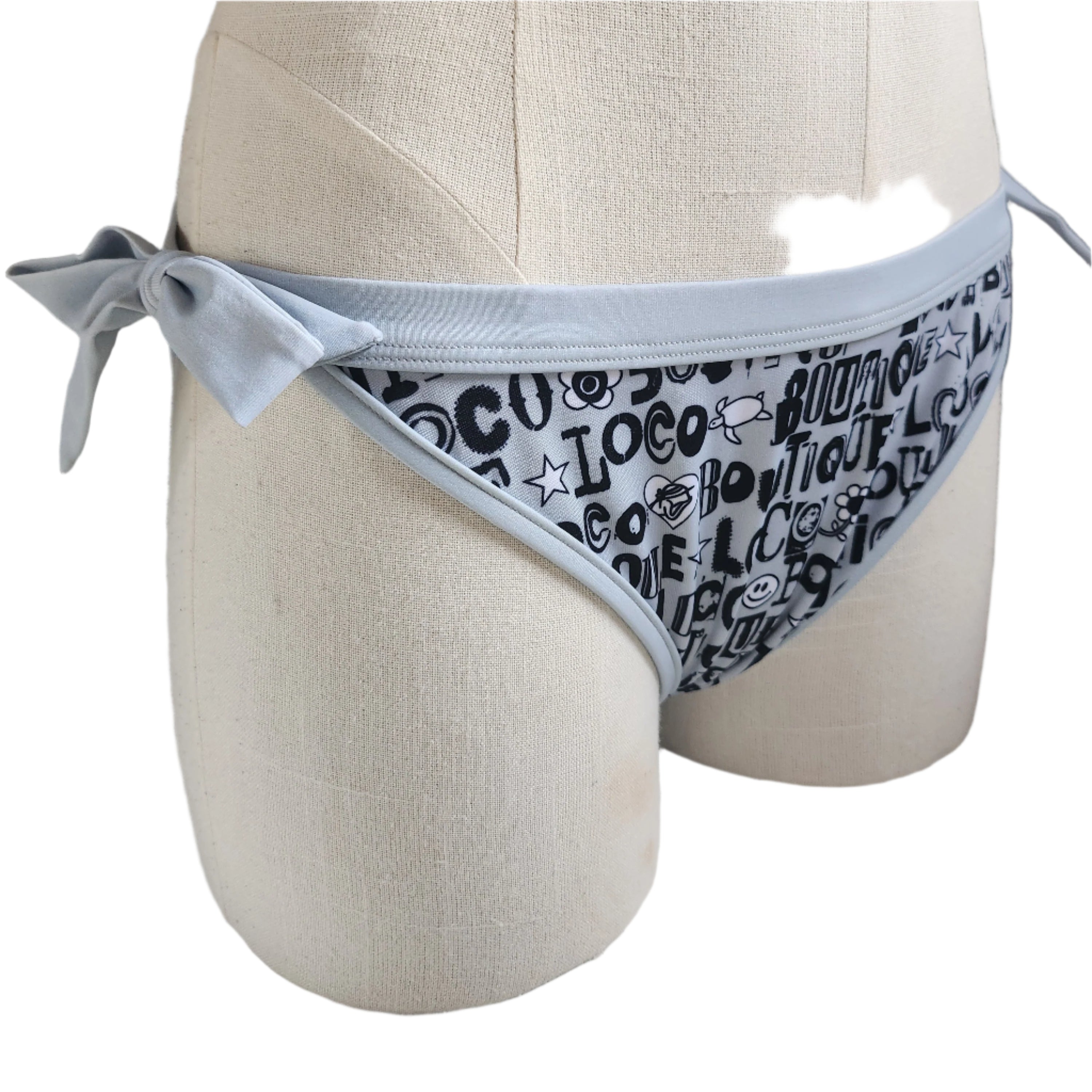 Gray bikini bottom with black text pattern on a mannequin.