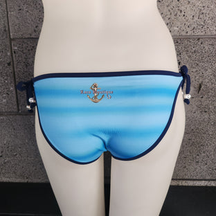 Bikini bottom with colorful fish design on a mannequin against a gray background