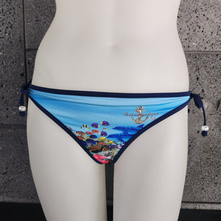 Bikini bottom with colorful fish design on a mannequin against a gray background