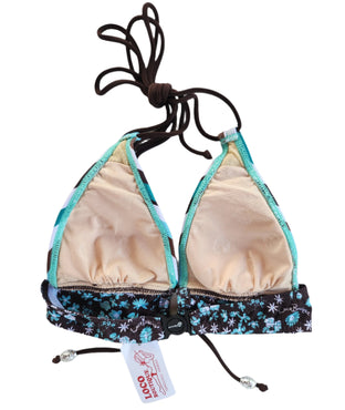 Striped bikini top on a mannequin with a white background