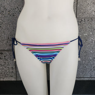 Colorful bikini bottom with cinched back on a mannequin against a tiled wall.