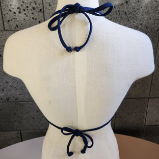 Brown ruffled bikini top on a mannequin against a white background.
