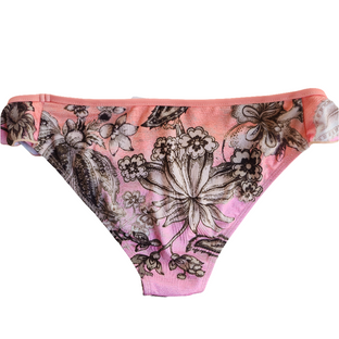 A close-up image of a person wearing a multicolor floral-patterned bikini bottom with side ruffles.