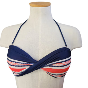 Navy blue bikini top with red and white stripes on a mannequin bust against a white background.