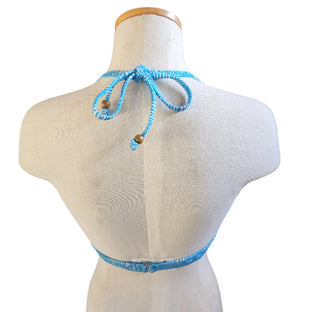 A flounce underwire bikini top in a mint color, displayed on a mannequin bust.