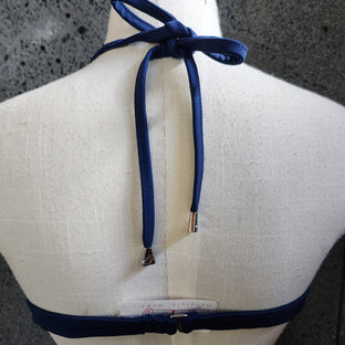 Floral designed halter top on a mannequin against a white background.