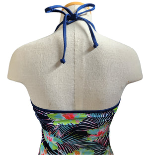 Colorful tankini with floral design on a mannequin against a white background