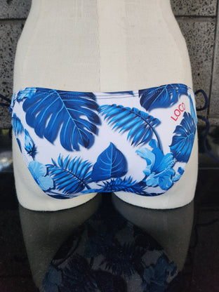 Woman wearing a blue and white floral bikini on a white background
