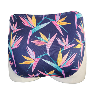 Navy blue swim bottom with colorful leaf pattern on a mannequin against a gray concrete wall.