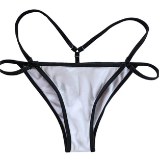 This image displays a minimalist-style women's bikini bottom. The piece features a clean, modern design with a predominantly white fabric and contrasting black trim.