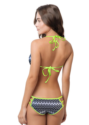 Woman wearing a bikini set with zig zag pattern on a white background.