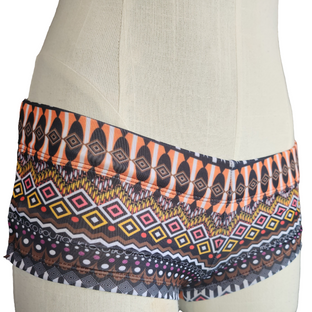 Blue and pink patterned shorts on a mannequin against a white background