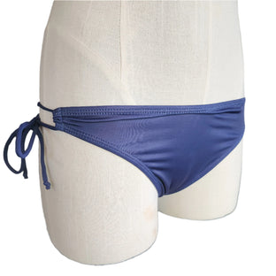 Blue bikini bottom on a mannequin against a white background