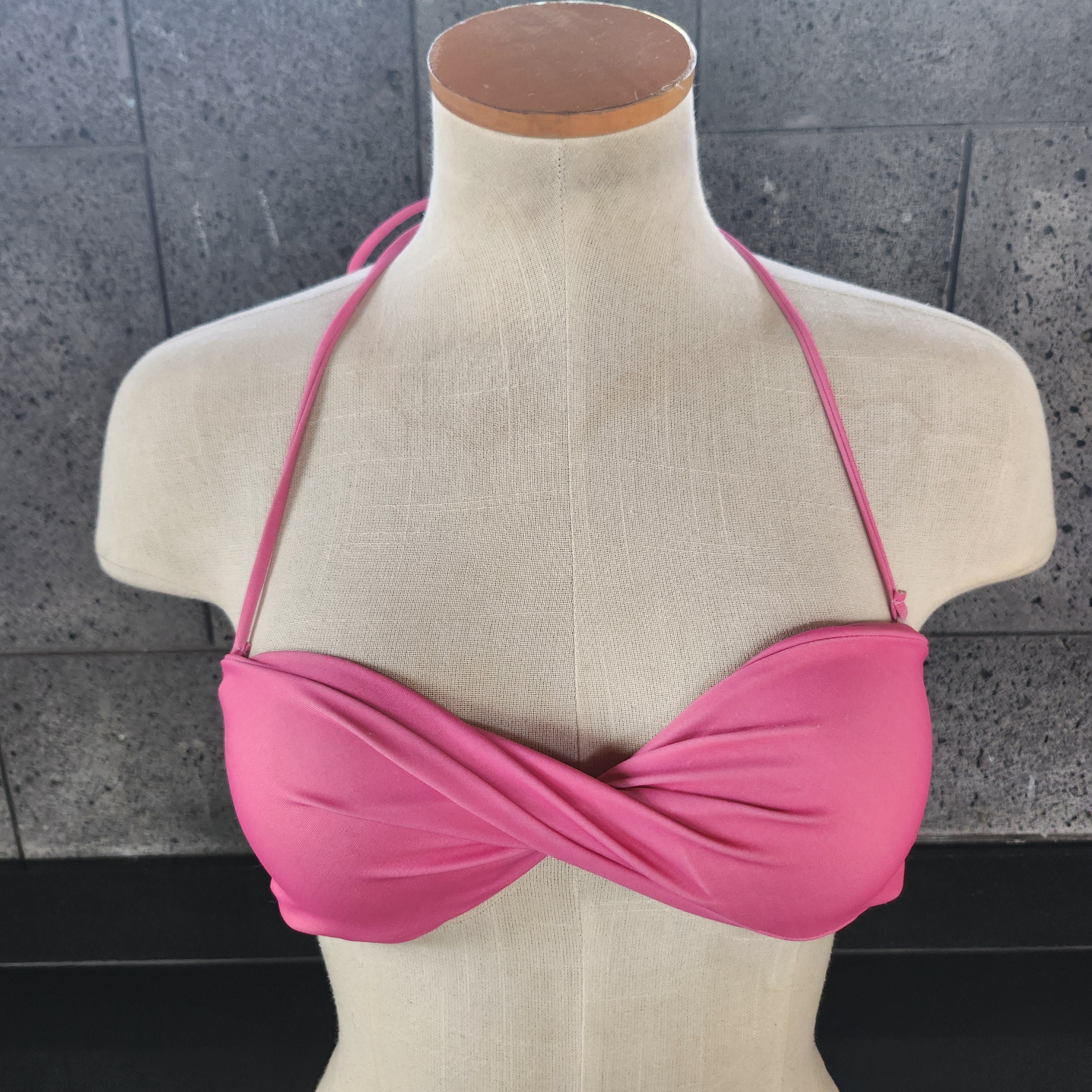 Brown twisted bandeau top on a mannequin against a white background.