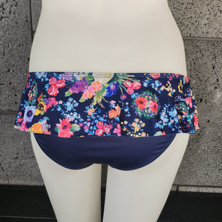 Floral-patterned underwear on a mannequin against a dark background